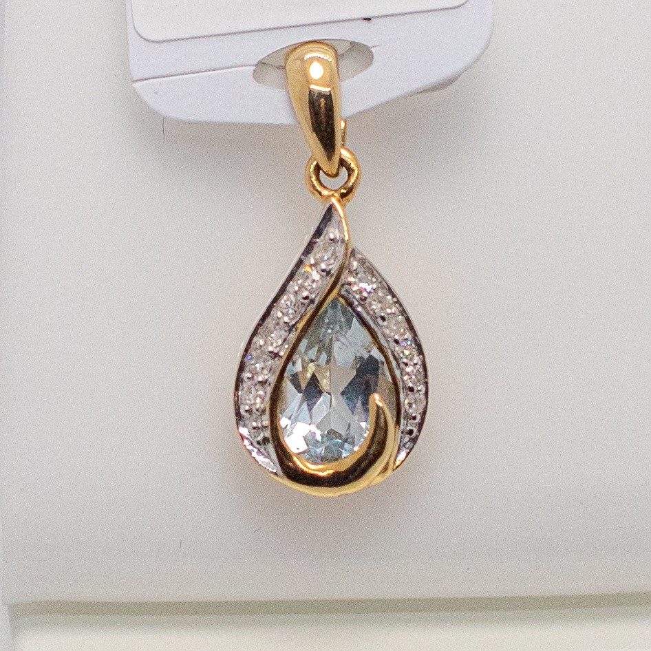 Pendentif or 750 topaze bleue et diamants